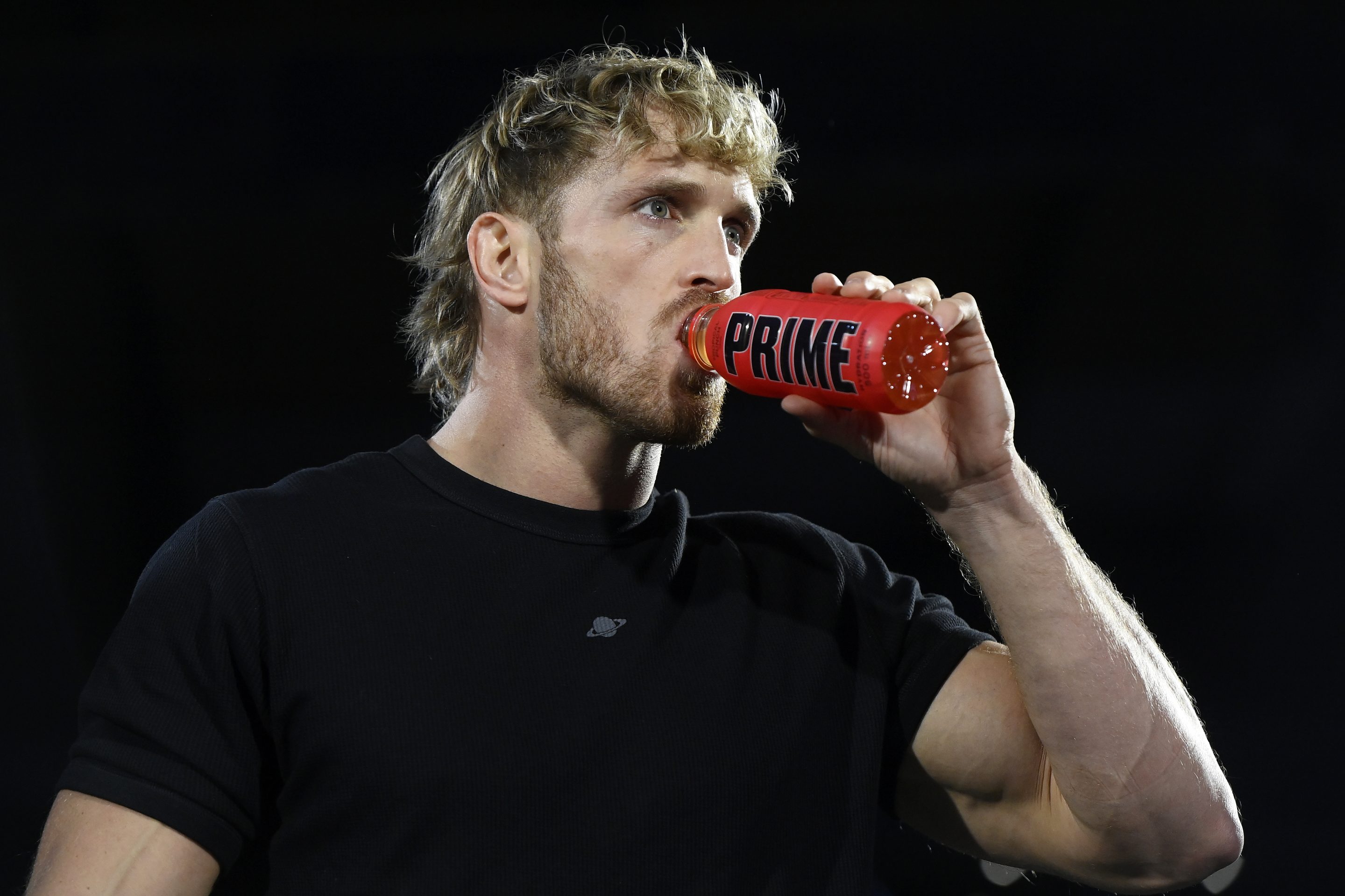 Logan Paul drinks a can of Prime, an energy drink
